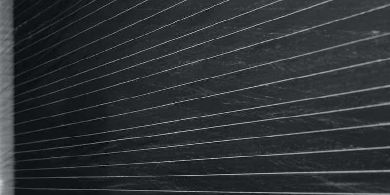 Close-up of Fiber Film, with reinforcing strands running through the film
