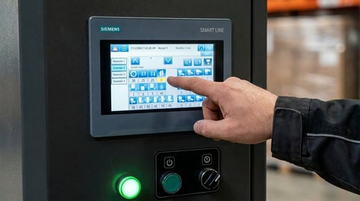 An operator using the INNOV8 touchscreen control panel