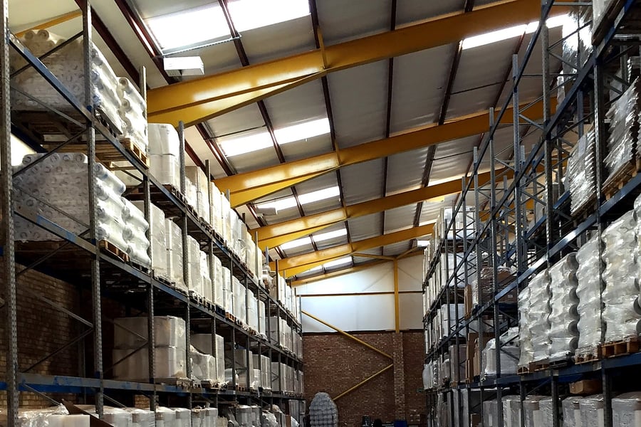 Our warehouse, with racking full of customers’ stretch film stock